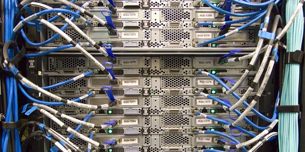 Image of the backside of a server and its cabling to represent how Creative Programs and Systems builds and sets up customized servers.